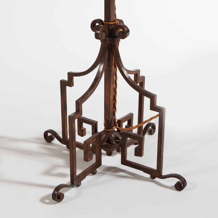 A patinated Steel floor standing bouillotte lamp base with key scrolls and foliate enrichments, France circa 1920.