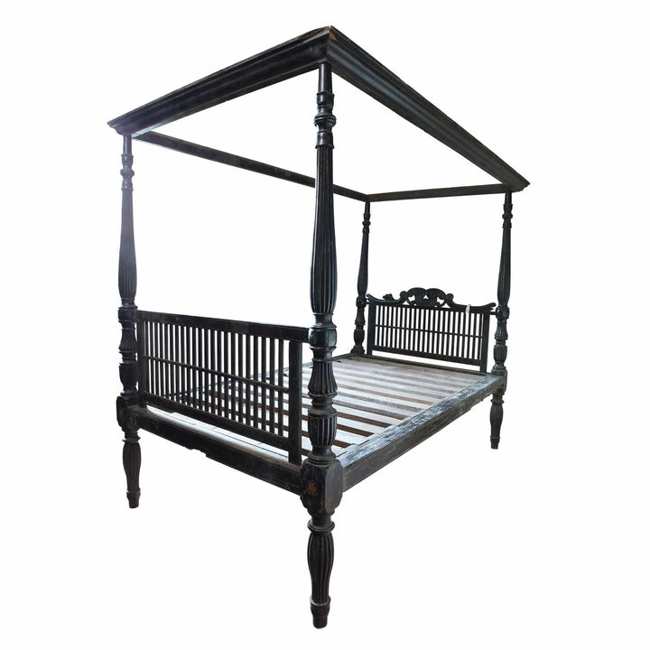Ceylonese solid ebony four-poster bed from Collection EE20 with carved posts and slatted headboard design