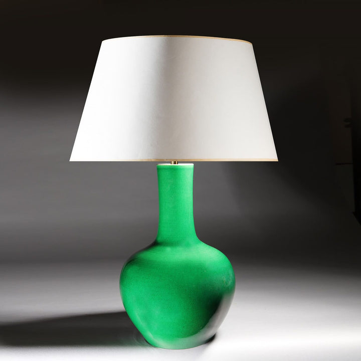 Monochrome Green Crackle Glaze Table Lamp with white shade and green porcelain base, mid-century Chinese design circa 1950.
