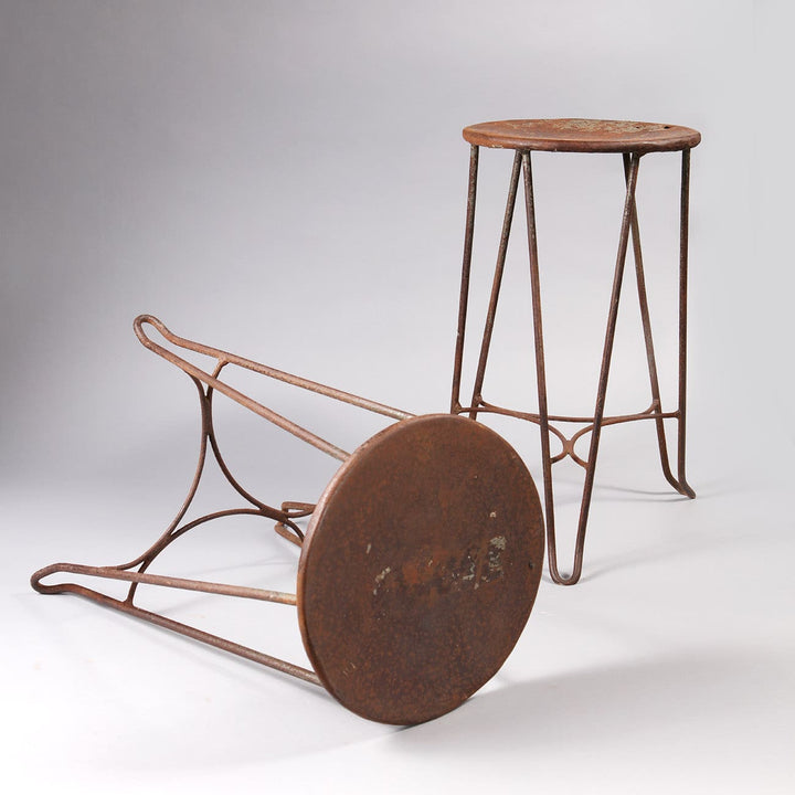 Pair of vintage industrial metal hairpin stools with rustic patina from Collection EE30, France circa 1950