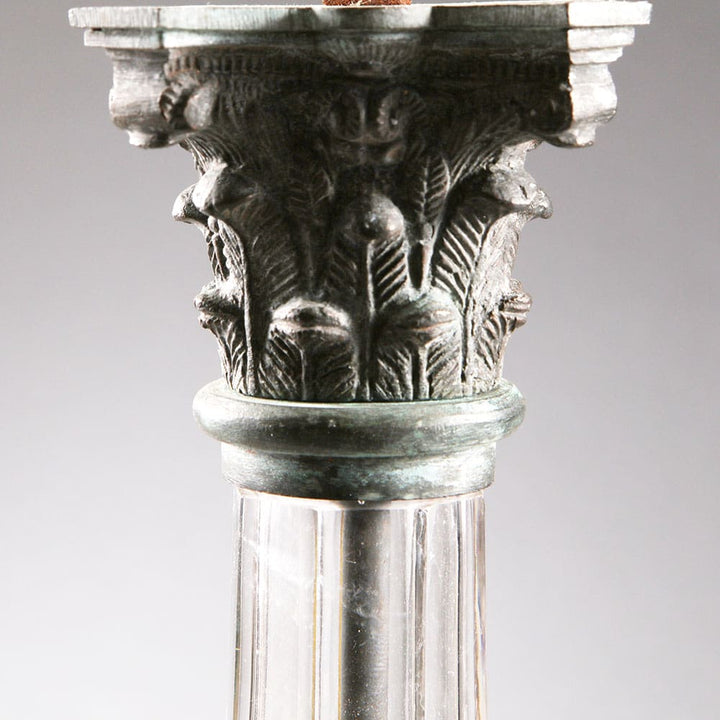 Pair of Clear Glass Faceted Column Lamps with bronze Corinthian capitals on clear faceted glass columns and square bases.