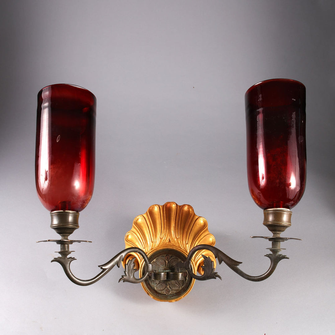 Pair of carved shell giltwood Mughal wall lights with brass arms and red glass shades from Collection EE10 circa 1880