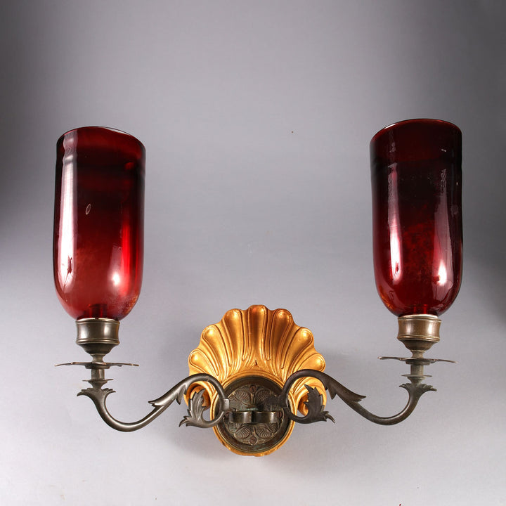 Pair of carved shell giltwood Mughal wall lights with brass arms and red glass shades from Collection EE10 circa 1880