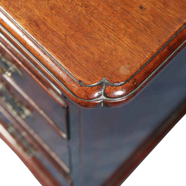Close-up of elegant mahogany chest of drawers corner showing fine craftsmanship by Collection CK20