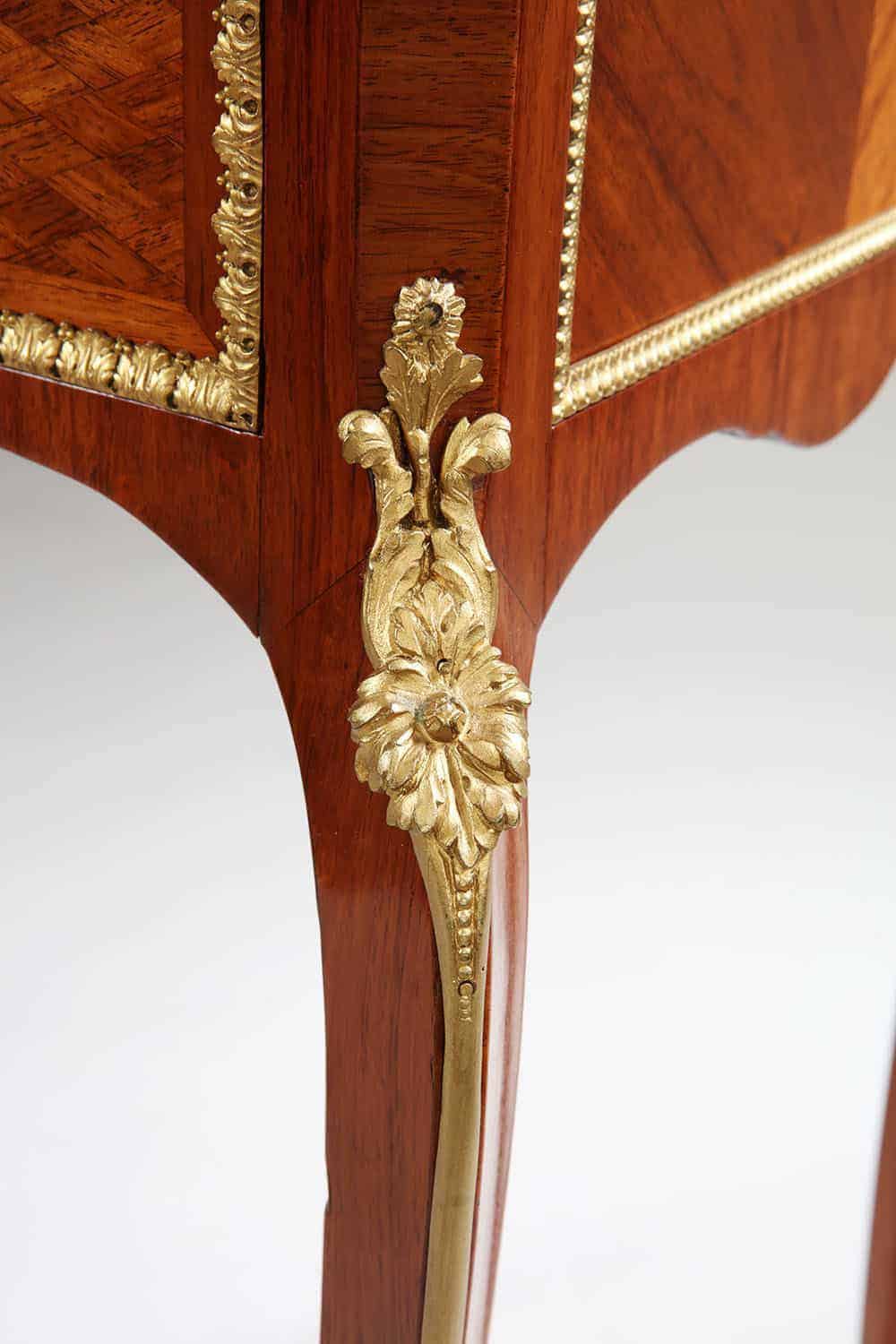 Close-up of gilt bronze floral decoration on a Napoleon III secretaire cabinet leg by Nwtiques