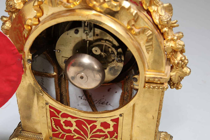 Interior view of gilt ormolu mechanism in 19th century Sèvres mantel clock by Nwtiques