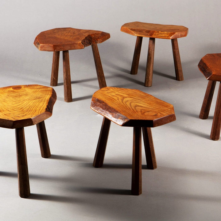 Set of five mid-century elm stools with three dark wood legs each from Collection EE30, circa 1960 France