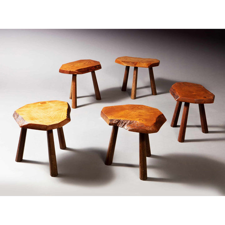 Set of five mid-century elm stools from Collection EE30, featuring natural wood grain and rustic design, circa 1960 France.