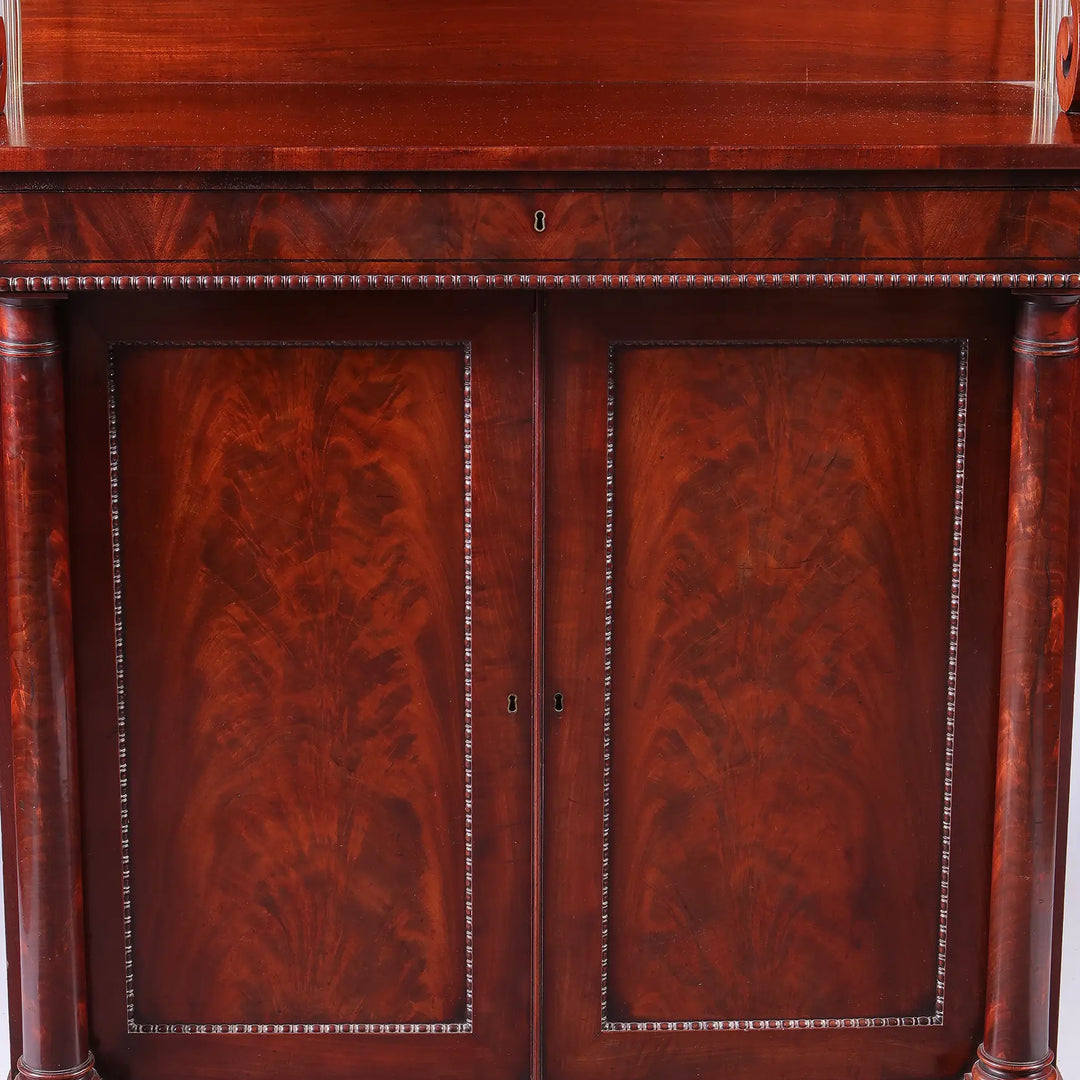 Early 19th century Regency flame mahogany chiffonier with gadrooned bun feet by Nwtiques