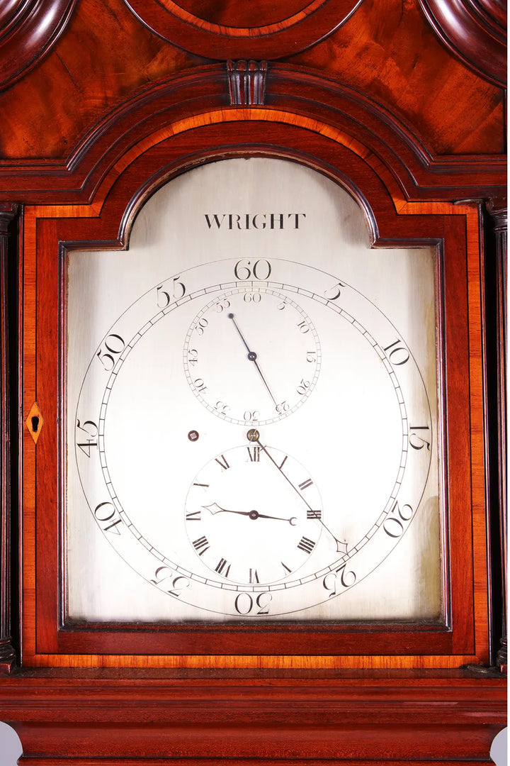 Close-up of a George III Thomas Wright mahogany longcase clock dial with silvered regulator face by Nwtiques