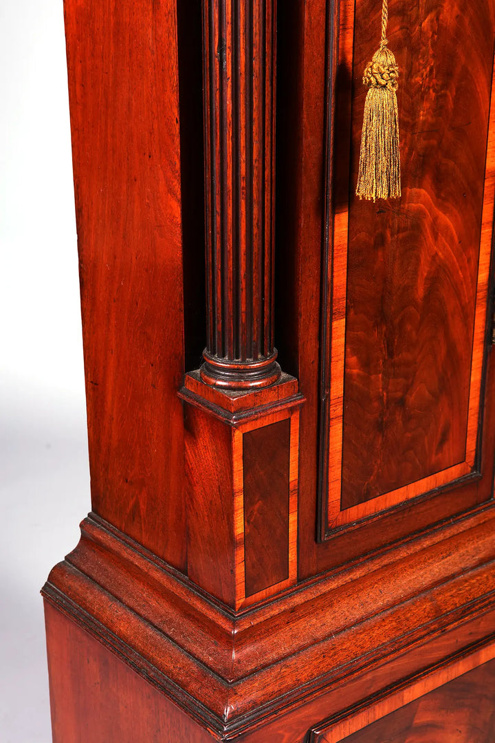 Close-up of George III mahogany longcase clock with detailed fluted column by Nwtiques