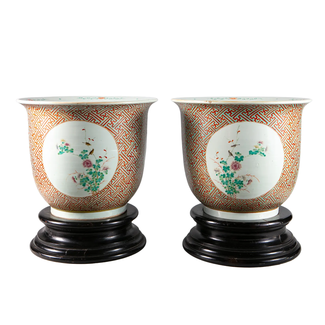 Pair of large Chinese porcelain jardinieres with floral medallions and geometric patterns on wooden bases by Nwtiques