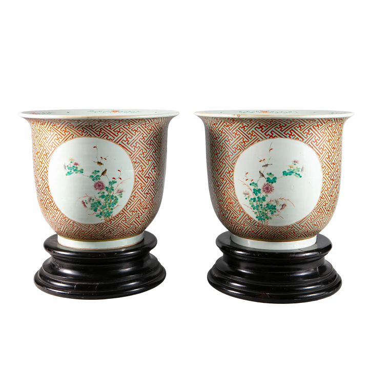 Pair of large Chinese porcelain jardinieres with floral medallions and geometric patterns on wooden bases by Nwtiques