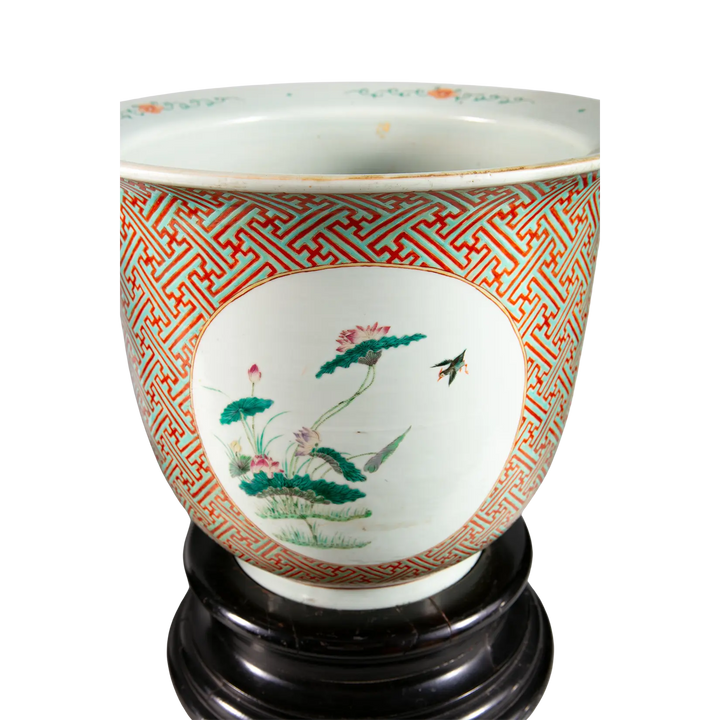 Large Chinese porcelain jardiniere with floral medallion and geometric patterns on wooden base by Nwtiques