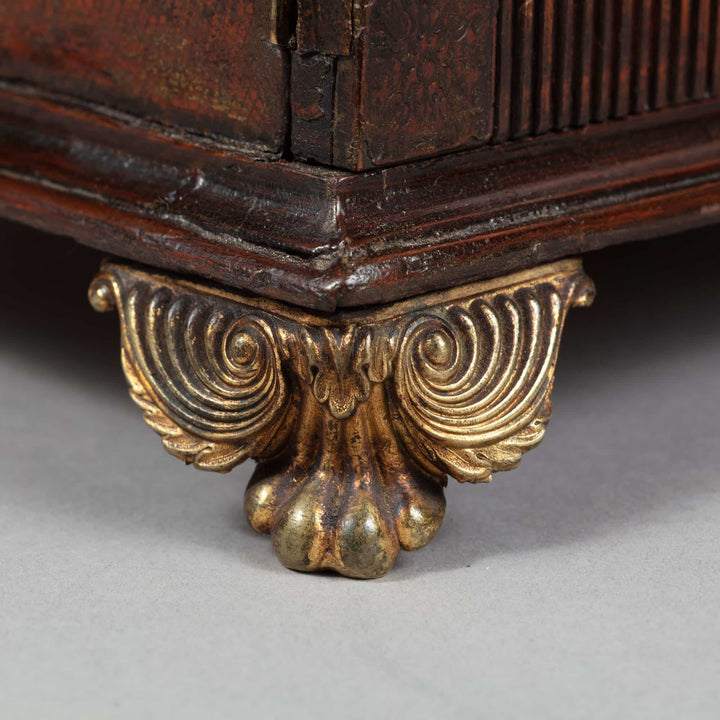 Close-up of ornate gold claw foot on Regency leather fitted table top casket by Collection CK10