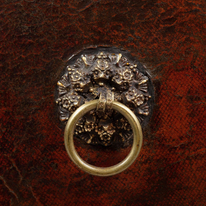 Close-up of ornate brass ring pull on Regency leather fitted table top casket from Collection CK10