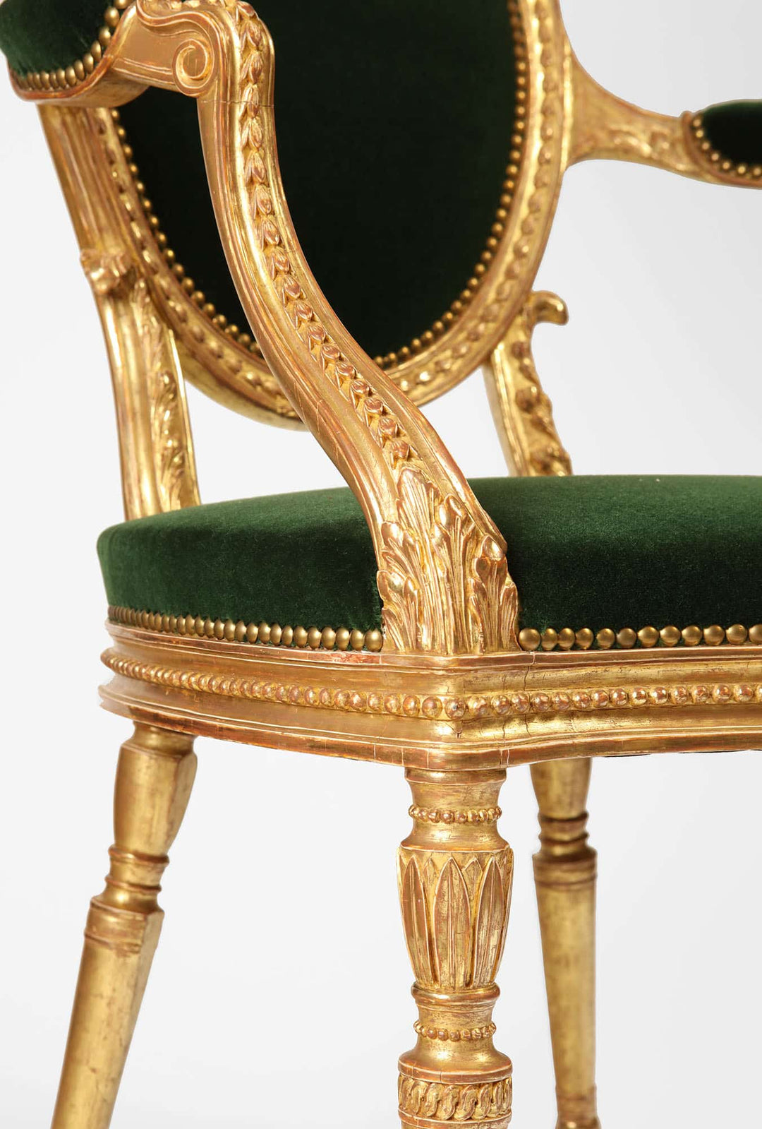 Close-up of a giltwood George III armchair with green silk velvet upholstery from Collection CK20
