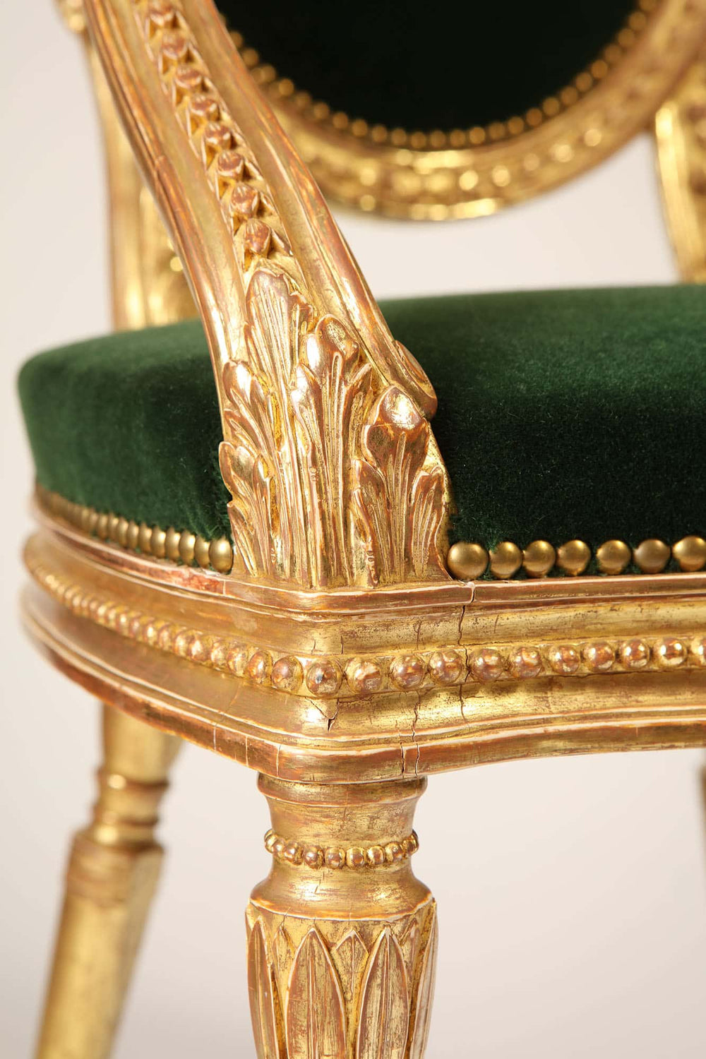 Close-up of a giltwood George III armchair with green silk velvet seat by Collection CK20