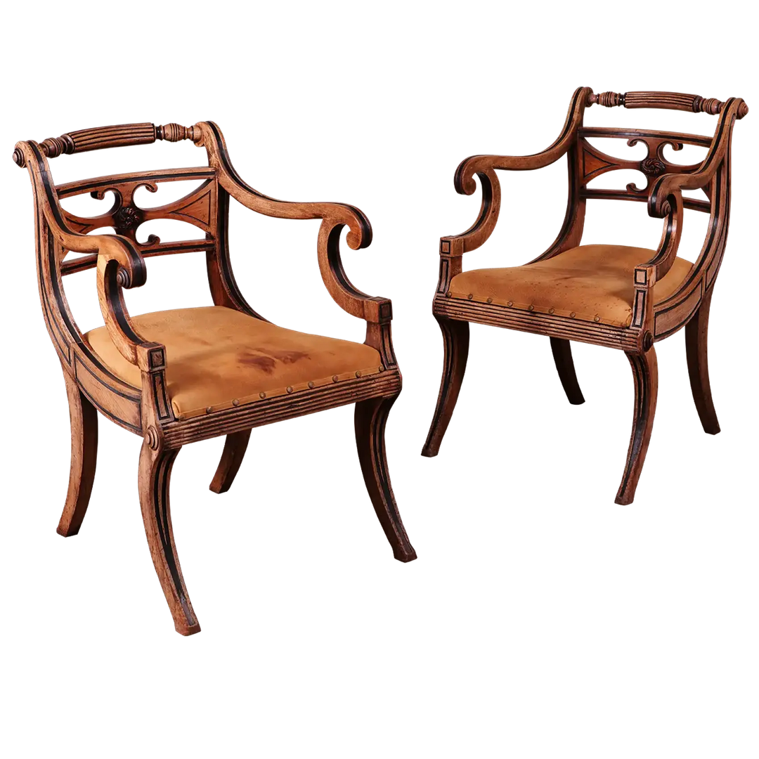 Pair of Regency armchairs with sculptural mahogany frame and leather seats from Collection PK10, circa 1815 England.