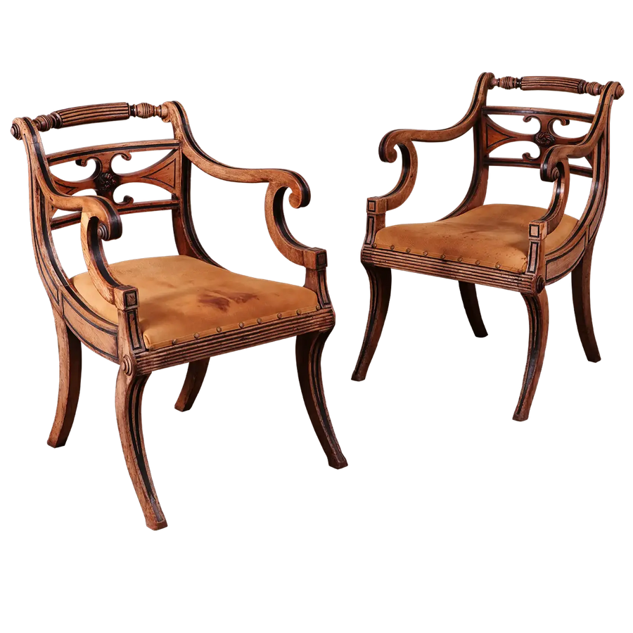 Pair of Regency armchairs with sculptural mahogany frame and leather seats from Collection PK10, circa 1815 England.
