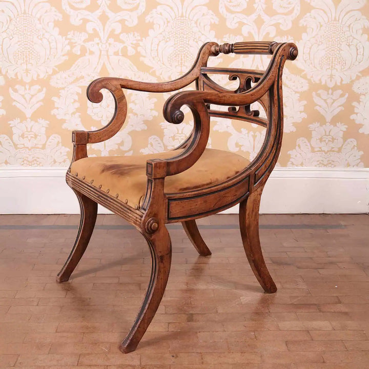 Pair of Regency armchairs in faded mahogany and leather upholstery from Collection PK10 with elegant black inlay detailing.