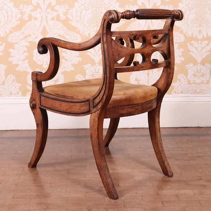 Regency armchair by Collection PK10 with faded mahogany and leather upholstery showcasing black inlay details and sculptural design.