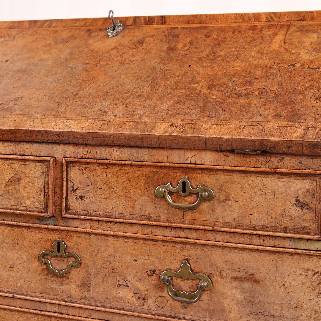 Close-up of burr walnut drawers and brass hardware on Ham House George I bureau by Nwtiques