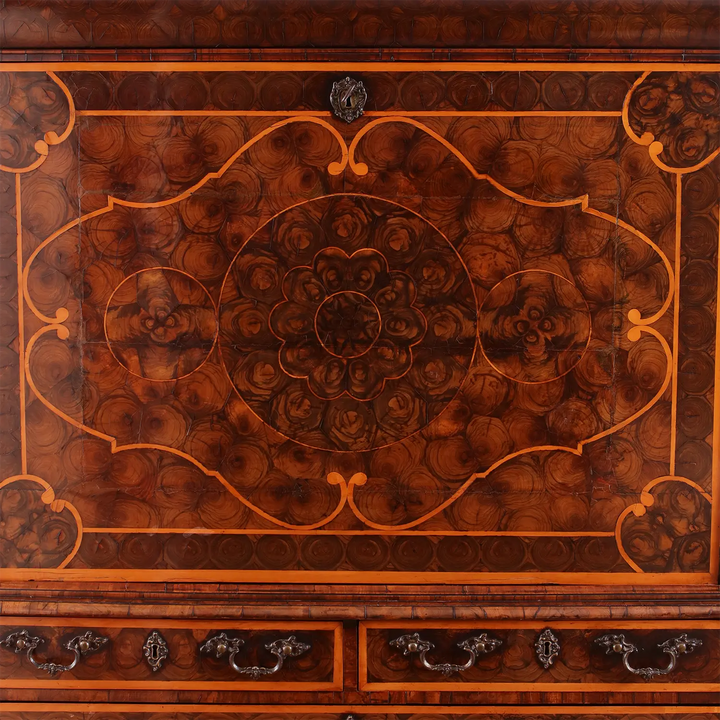 Close-up of intricate oyster laburnum veneer pattern on William and Mary secretaire cabinet by Collection PK10