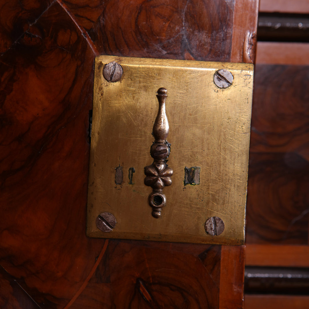 Close-up of ornate brass lock and keyhole on antique William and Mary Laburnum Oyster Secretaire Cabinet Collection PK10