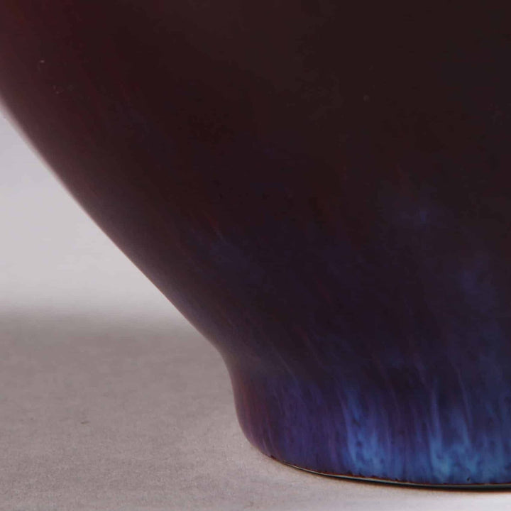 Chinese Sang de Boeuf Vase mounted as a table lamp showcasing deep red glaze and elegant curved base, circa 1980 China.