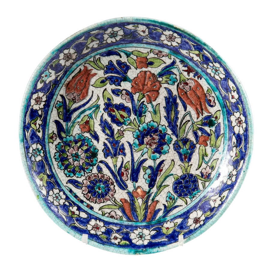 18th-century Ottoman Iznik plate by Nwtiques with floral motifs in blue, turquoise, and sage green colors