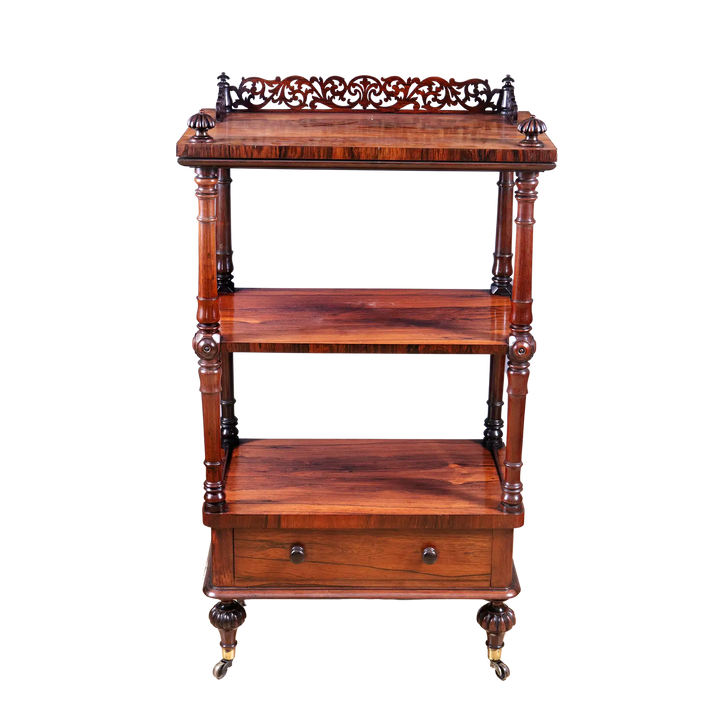 Victorian Rosewood Whatnot Etagere with three tiers, drawer, turned columns, brass castors, circa 1850 English craftsmanship.