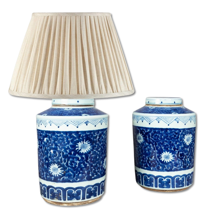 Pair of Chinese Blue and White Porcelain Ginger Jars as Lamps with floral patterns and one fitted with a beige lampshade.