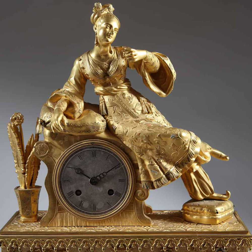 19th-century gilt bronze Ottoman mantle clock featuring a seated lady, from Nicholas Wells Antiques.