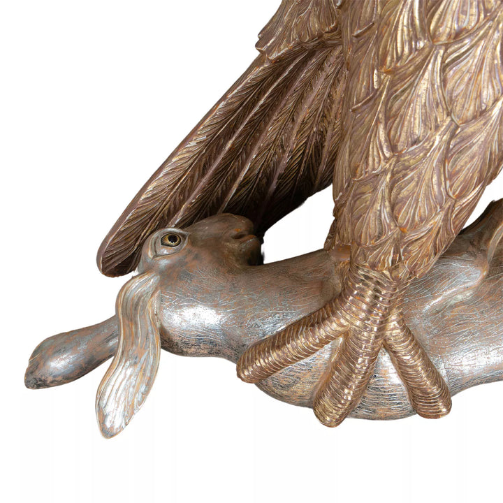 Carved Giltwood Eagle & Ebonised Column shows a gilded eagle clutching a silver hare with detailed feathers and claws.