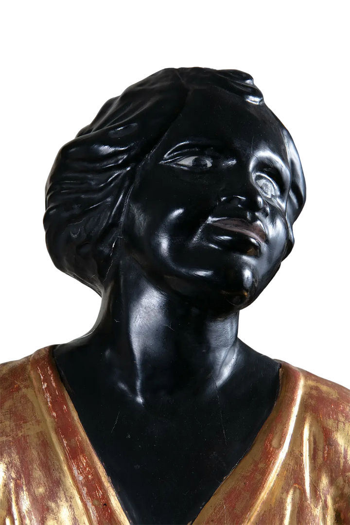 Close-up of 19th century Italian Blackamoor figure in gilt cloths by Nwtiques
