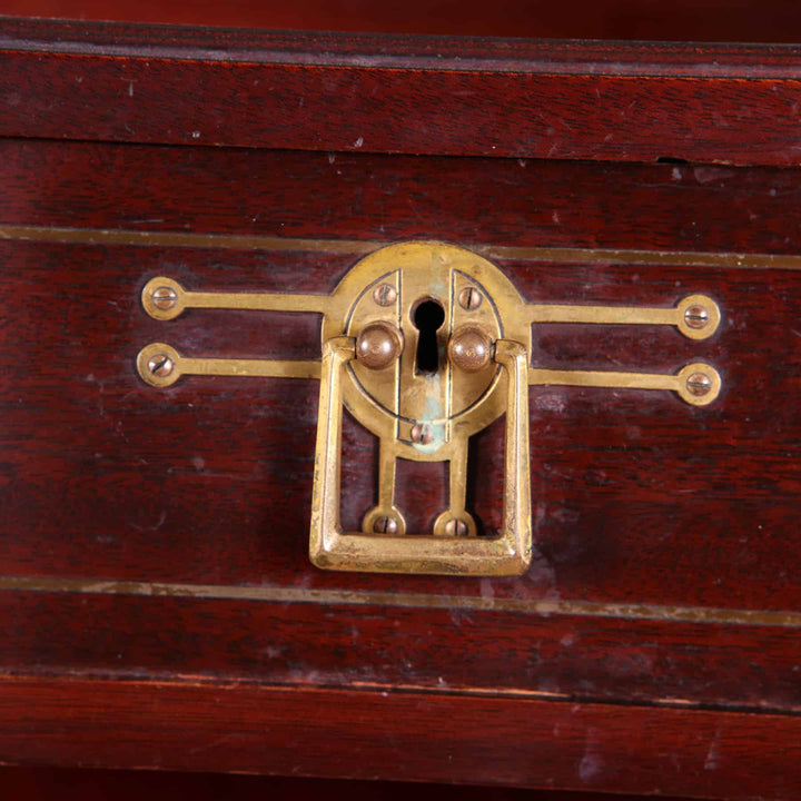 Close-up of an ornate brass lock on a German Secessionist cabinet by G. Ritter, Dresden, Collection EE40.