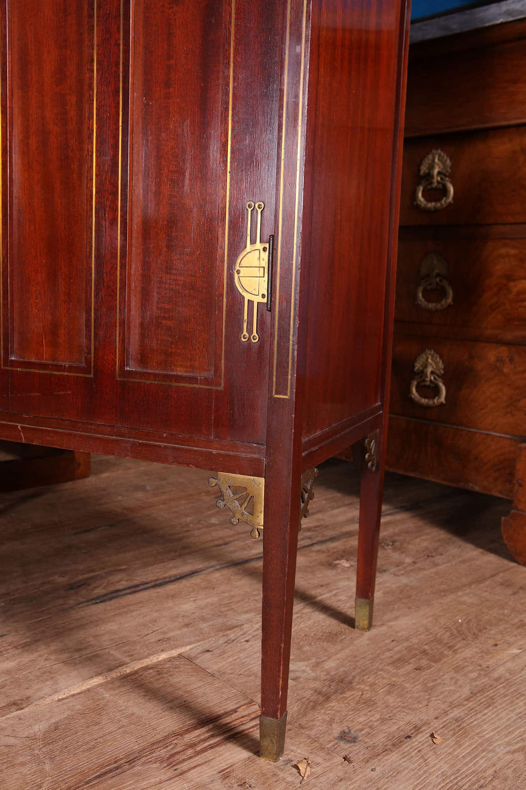 Close-up of German Secessionist cabinet leg and door with brass details by G. Ritter, Collection EE40.