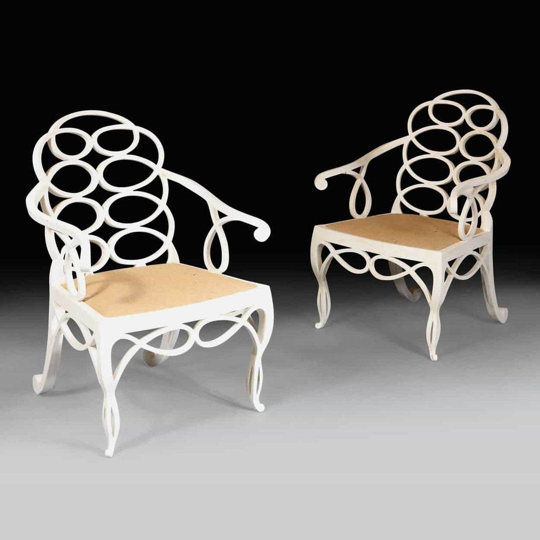 Elegant matt white Loop Chairs with hoop back design and natural seats by Collection EE30, sold individually