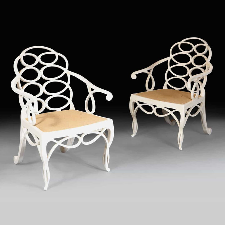 Elegant matt white Loop Chairs with hoop back design and natural seats by Collection EE30, sold individually