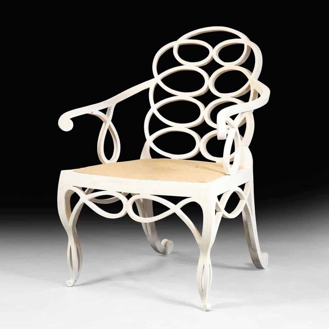 Elegant matt white Loop Chair with hoop back design and intricate construction from Collection EE30