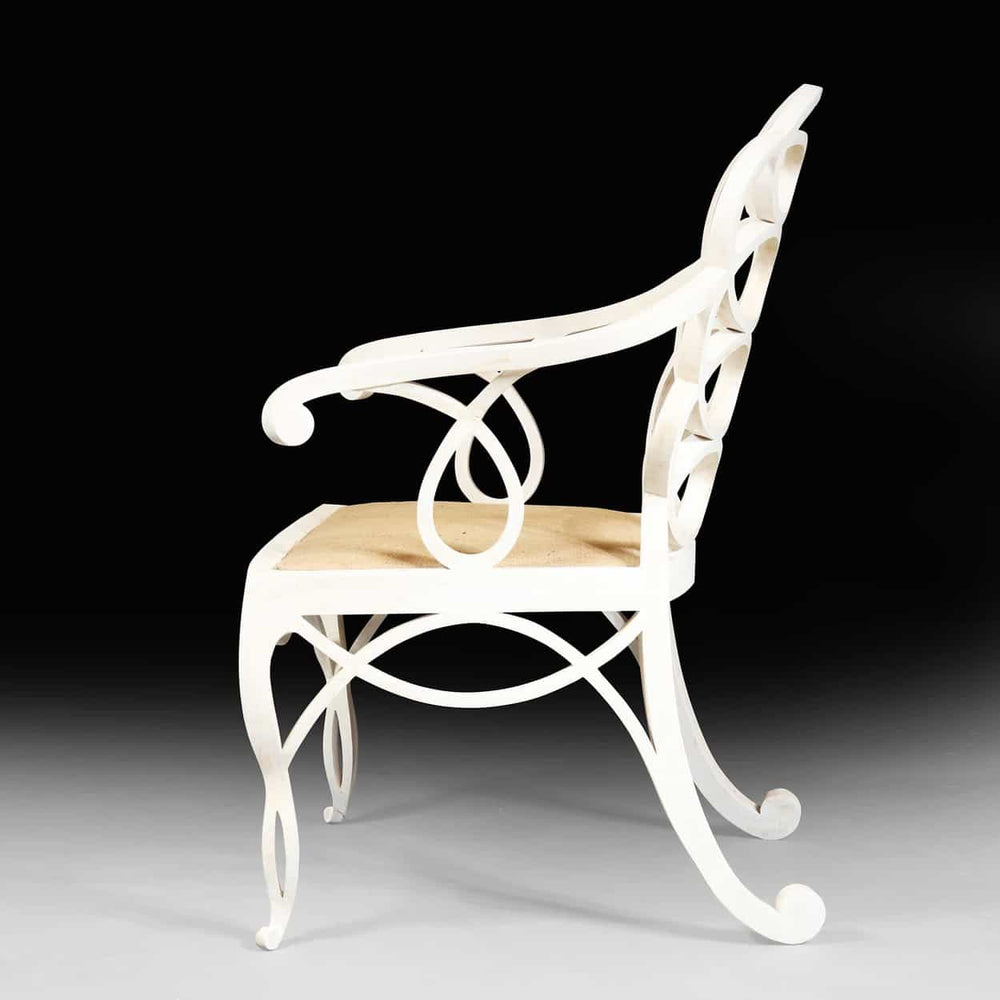 Elegant matt white Loop Chair with hoop back design and woven seat by Collection EE30, side view on black background