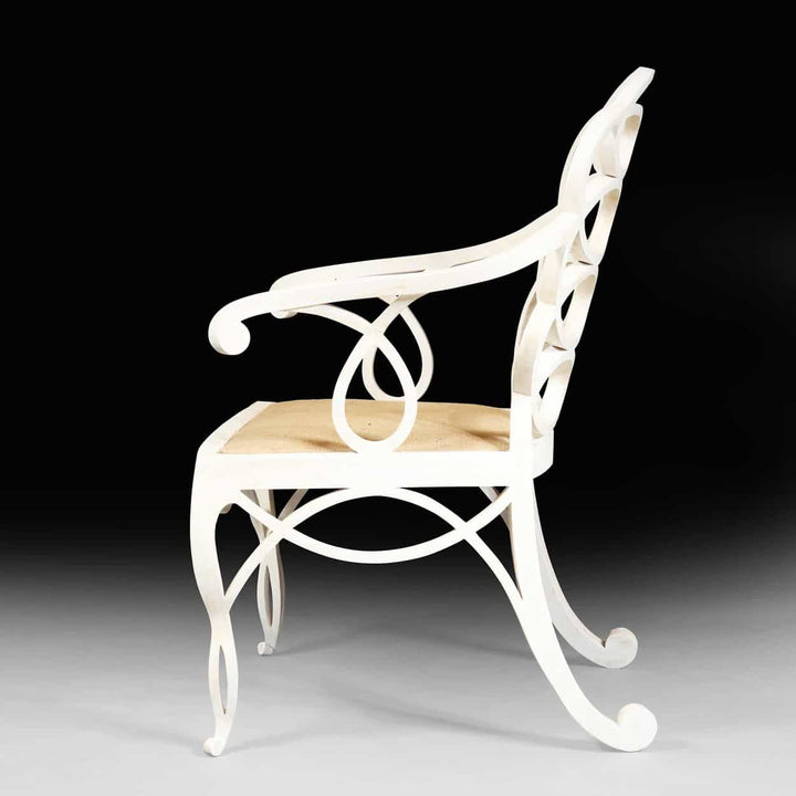 Elegant matt white Loop Chair with hoop back design and woven seat by Collection EE30, side view on black background
