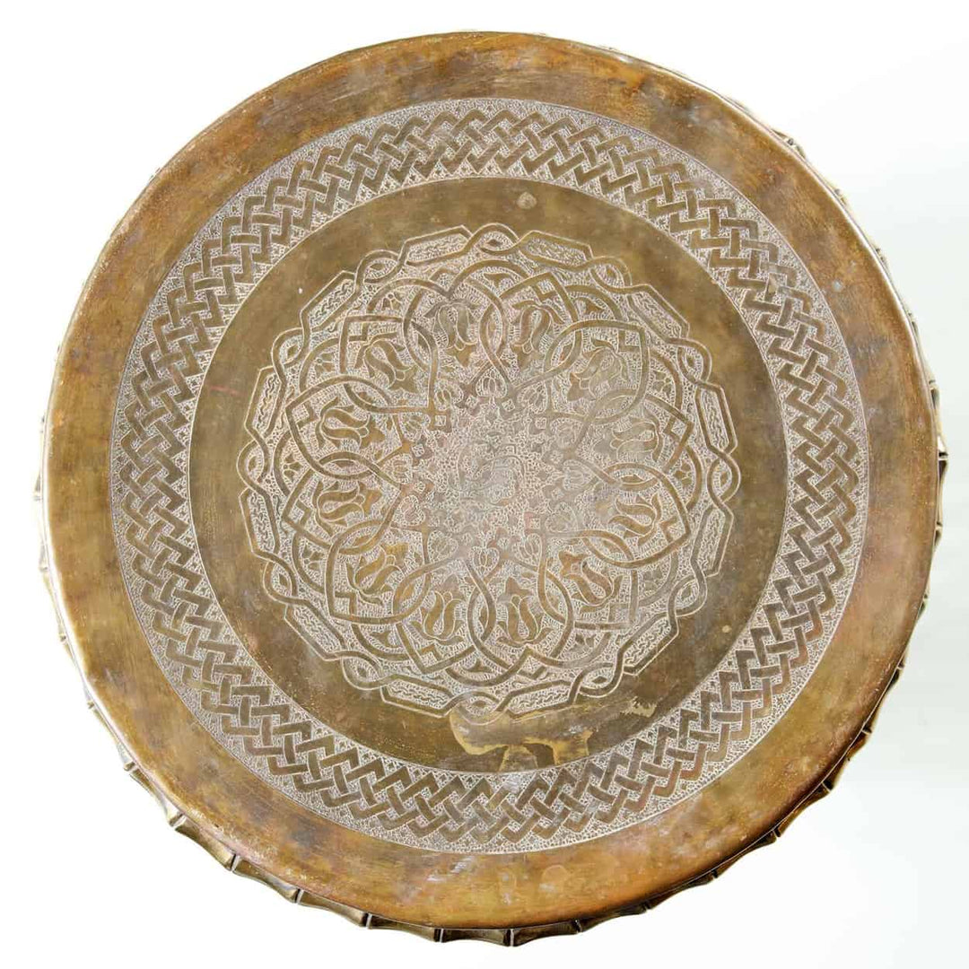 Top view of a pierced faux bamboo brass stool with intricate pattern by Collection EE30 from India circa 1970