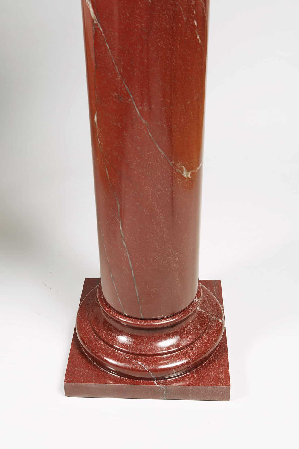 Rosso Marble Pedestal with polished red marble column, turned base on plinth, and rotating turned capital, Italy circa 1900.