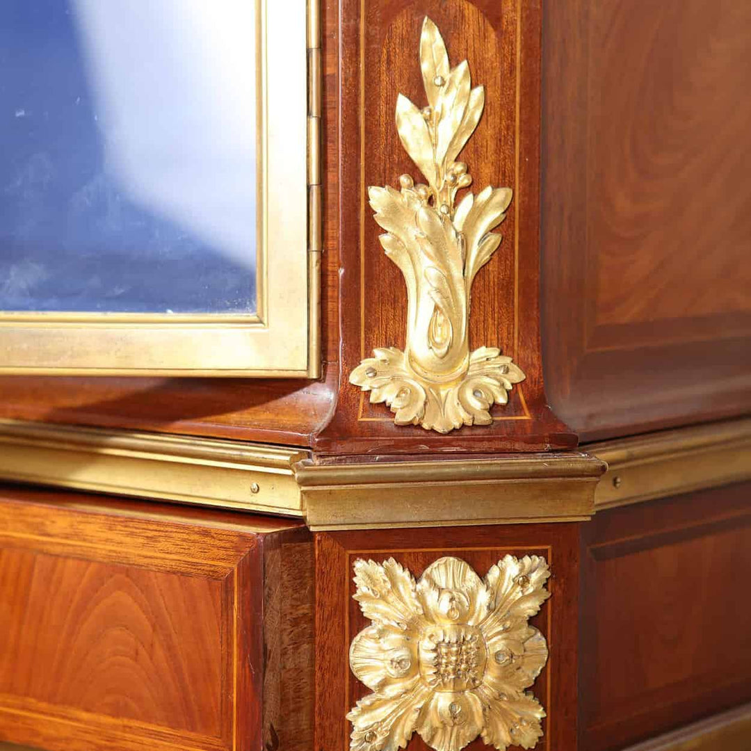 Close-up of intricate gilt bronze floral mounts on a Napoleon III French vitrine cabinet by Nwtiques
