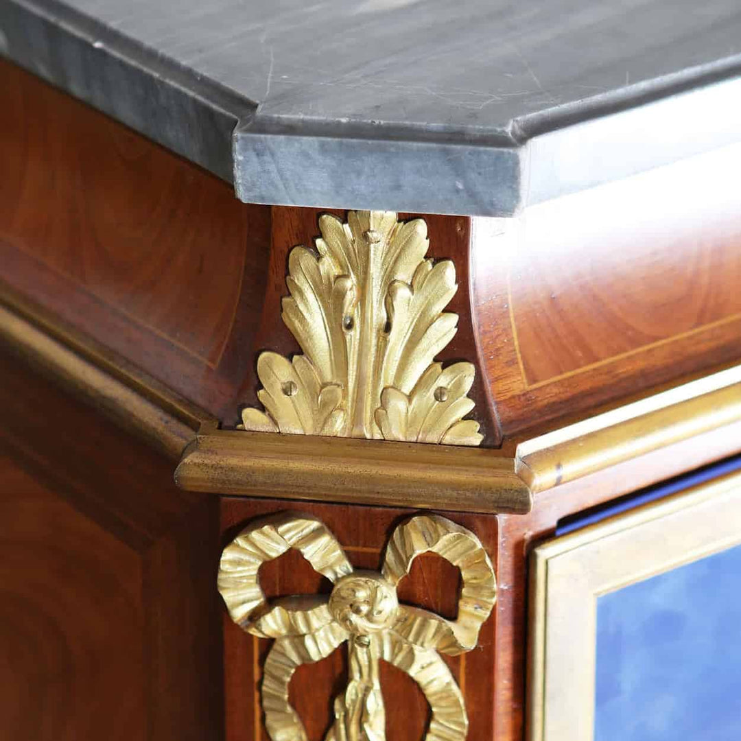 Detail of gilt bronze mount and grey marble top on a late 19th century Napoleon III cabinet by Nwtiques
