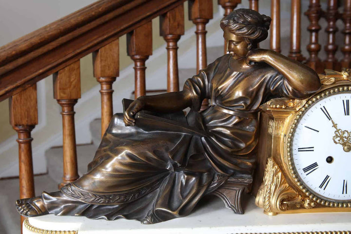 Patinated bronze figure of a woman reading, part of a French Neo Classical mantel clock by Nwtiques.