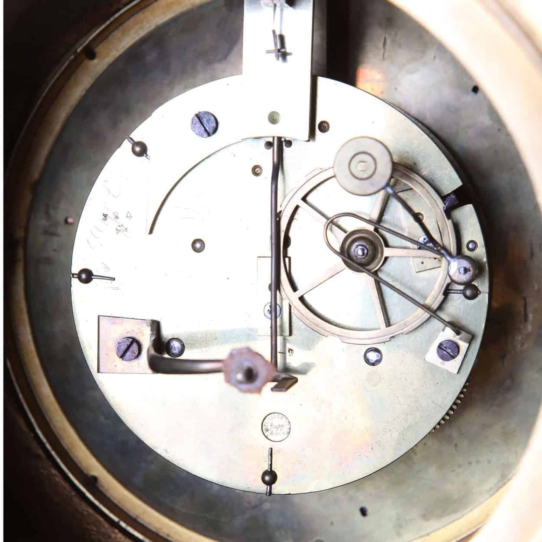 Close-up of the inner clockwork mechanism of a Fine French Neo Classical mantel clock by Nwtiques