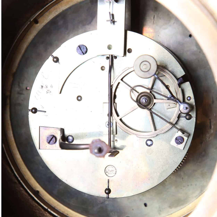 Close-up of the inner clockwork mechanism of a Fine French Neo Classical mantel clock by Nwtiques